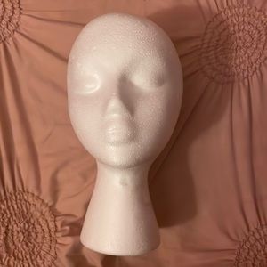 It’s a white mannequin head